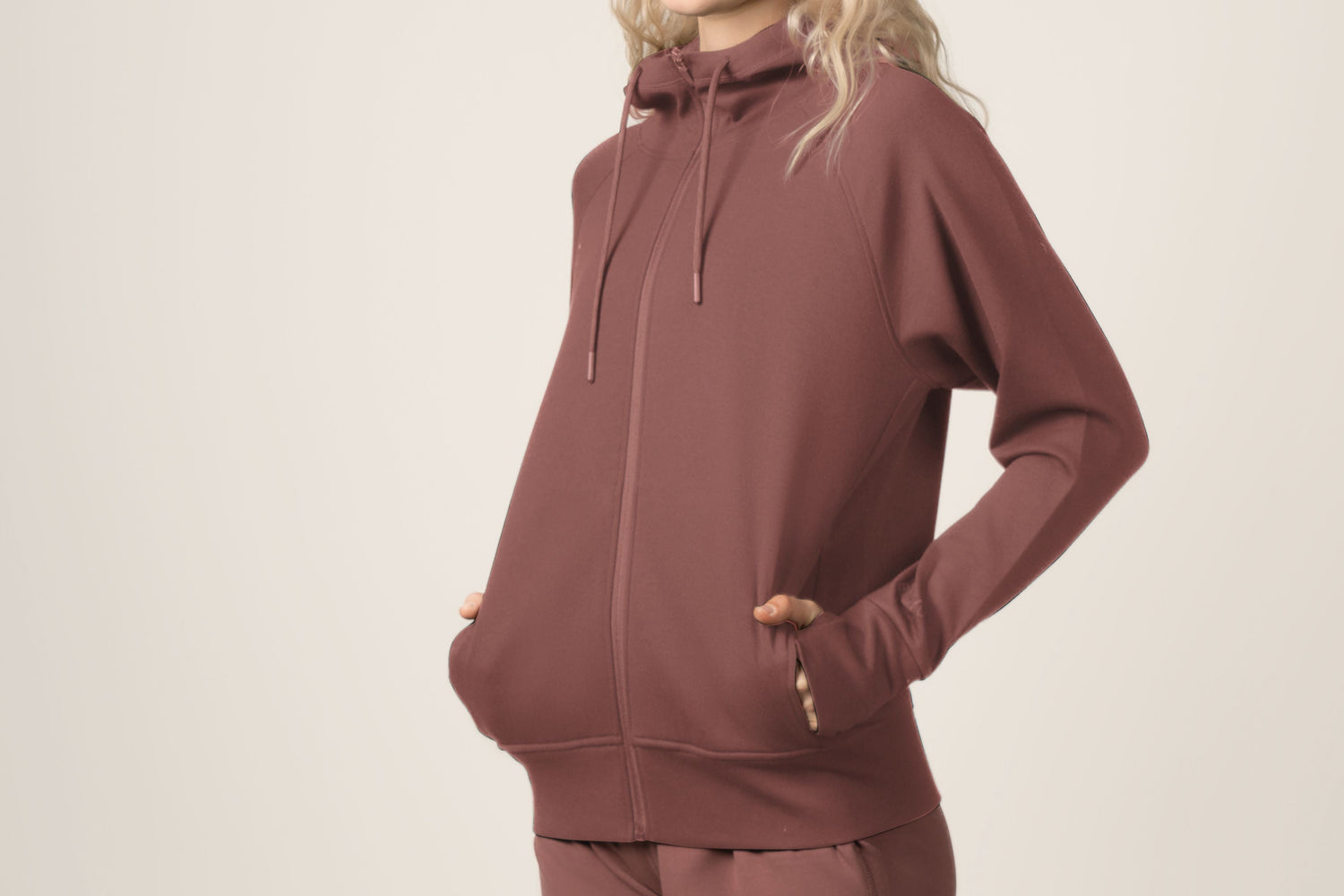 IMAGE OF WOMEN IN FULL-ZIP HOODIE