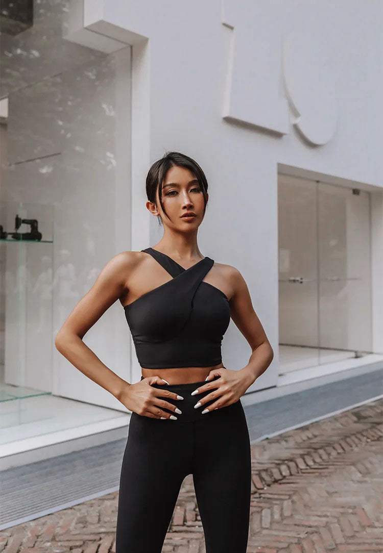 Chic Asymmetry: One-Shoulder Cross-Front Crop Top in Black